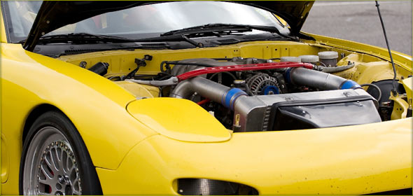 Engine bay of a yellow sports car